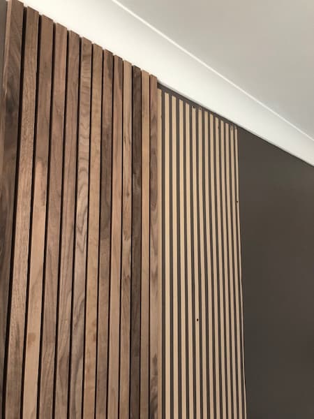 American black walnut wooden strips attached to the MDF panel on the feature wall
