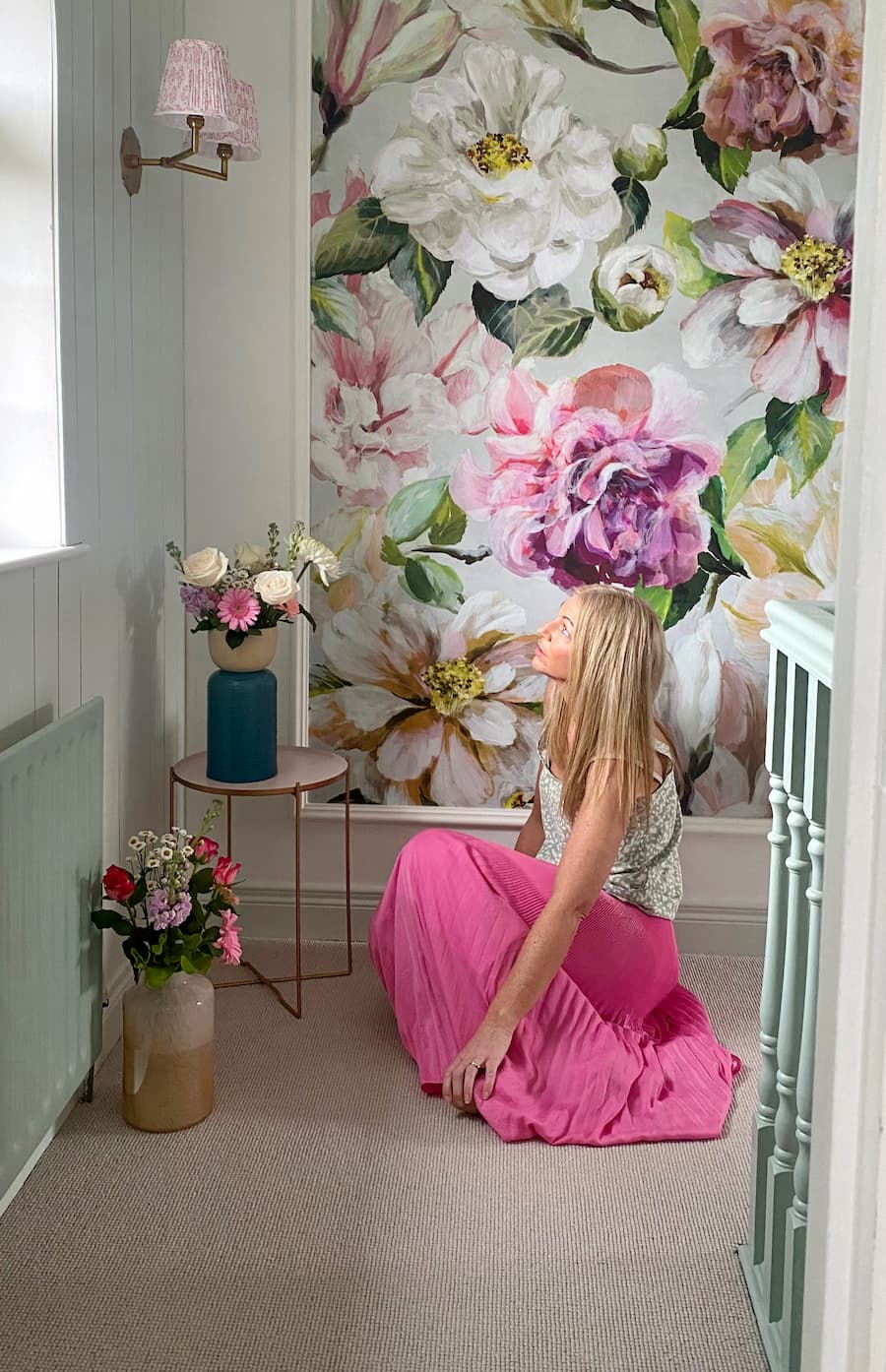 Bold floral wall paper panel at the top of the landing