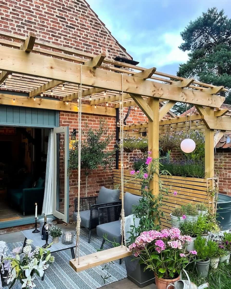 Outside space with pergola and pergola swing during the day