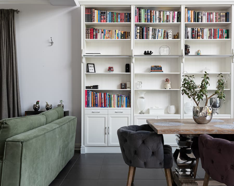 Floor to ceiling built in bookcase against the wall to maximise storage space