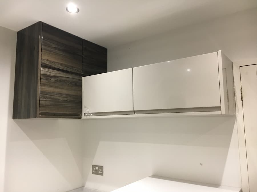 Modular wall units with doors added, three have a walnut gloss and three have a mocha gloss
