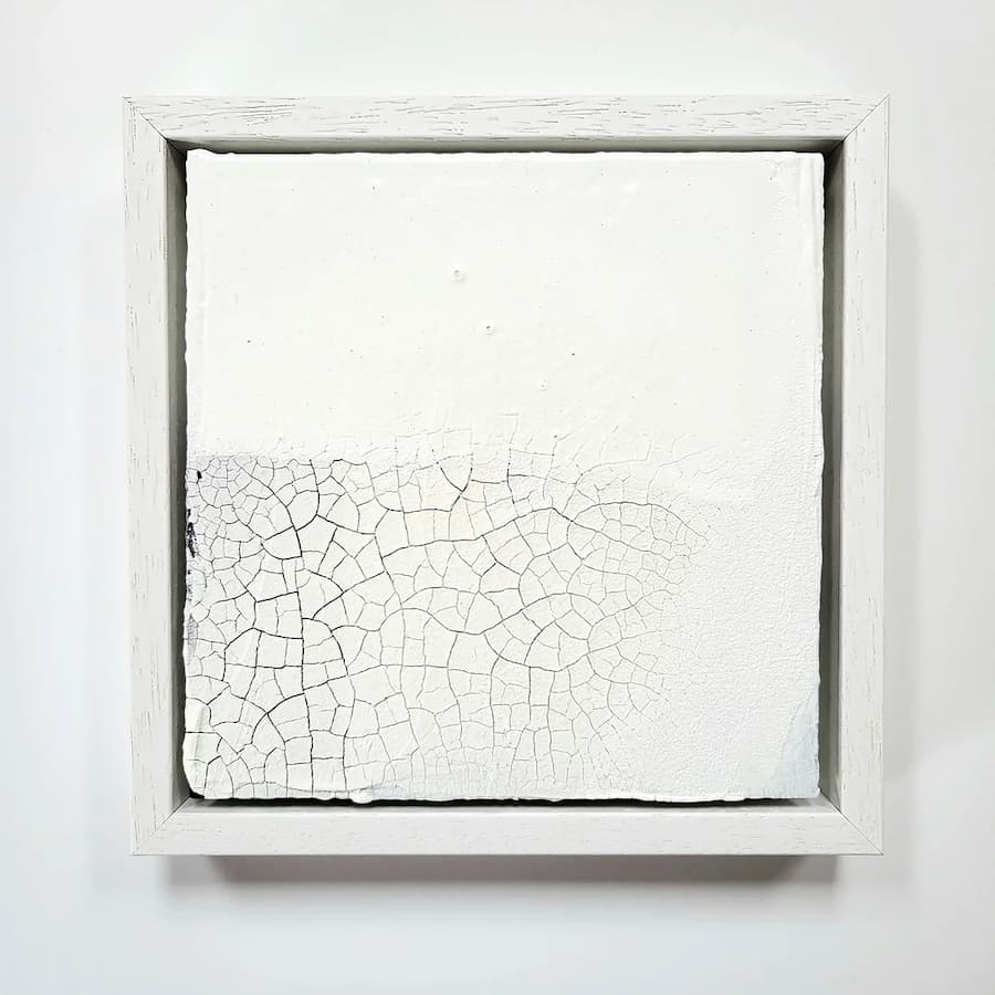 Modern white painting with cracked effect at the bottom
